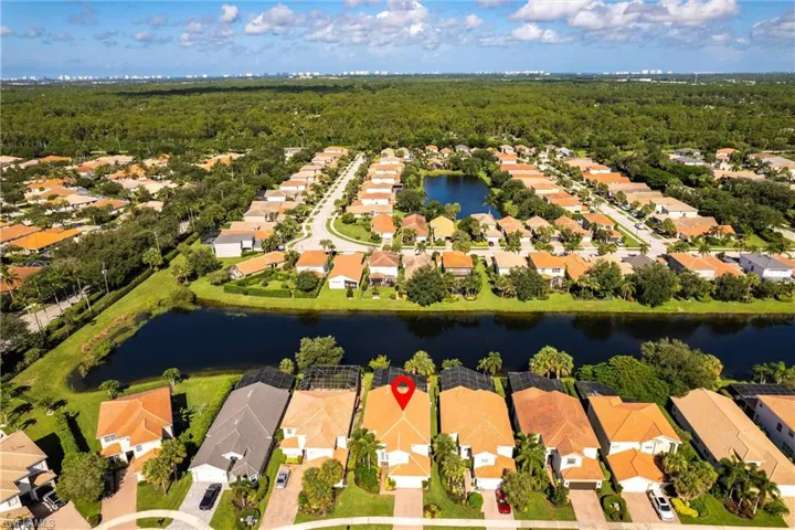 Aerial view of residential area with a nearby body of water
