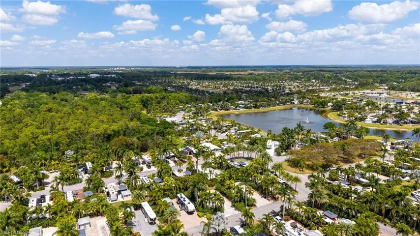 Aerial view featuring a residential view and a water view