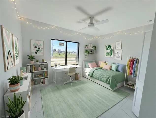 Bedroom with an office area and ceiling fan