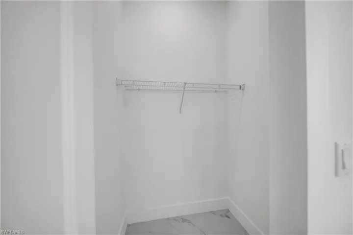 Spacious closet with marble finish flooring