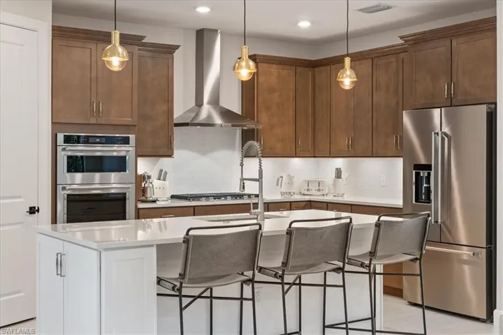 Dining area featuring an inviting chandelier and baseboards