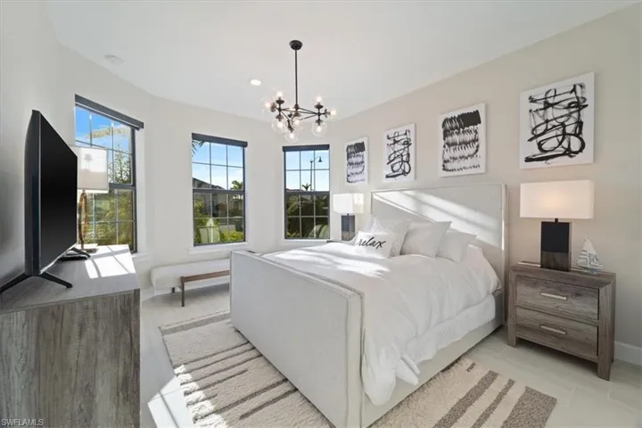 Bedroom featuring recessed lighting, visible vents, baseboards, light wood finished floors, and an inviting chandelier