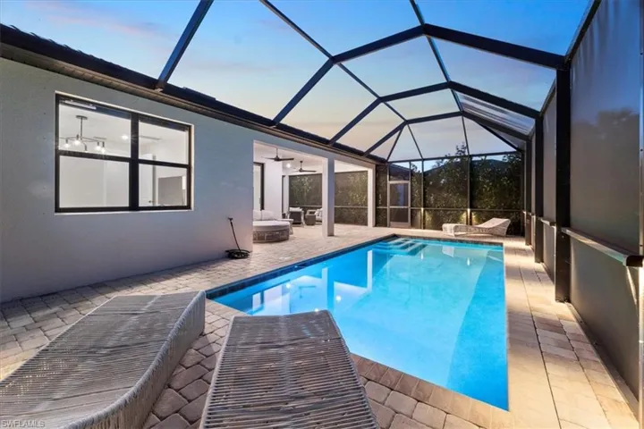 Birds eye view of property featuring a view of trees