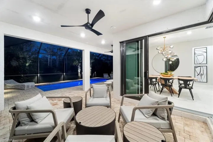 Birds eye view of property with a water view and a residential view