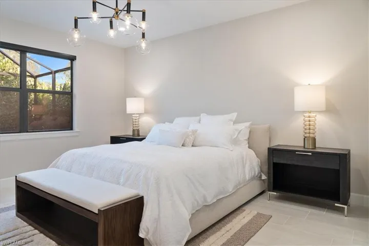 Bedroom featuring recessed lighting, baseboards, and an inviting chandelier