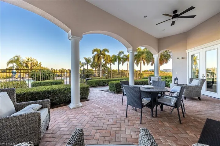 View of patio / terrace with a ceiling fan, outdoor dining area, and french doors