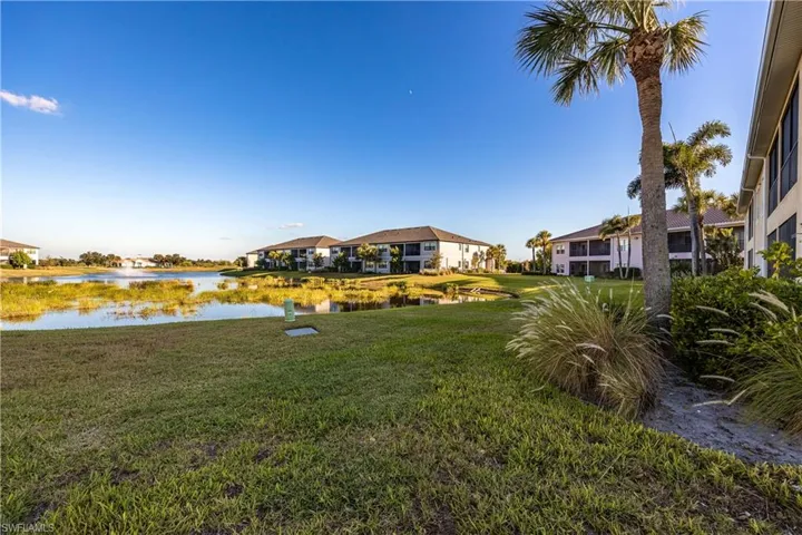 View of green lawn with a water view