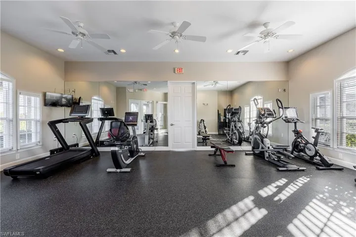 Workout area featuring recessed lighting