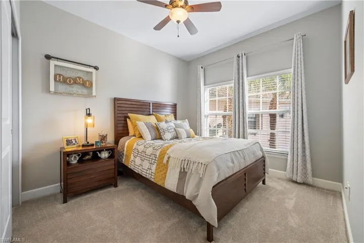 Bedroom featuring carpet and a ceiling fan