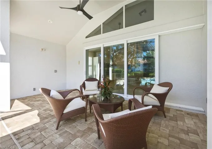 Covered patio featuring a vaulted ceiling with a ceiling fan, recessed lighting, and large sliding glass doors