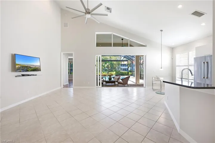 Vaulted ceilings with an angular architectural design and a ceiling fan