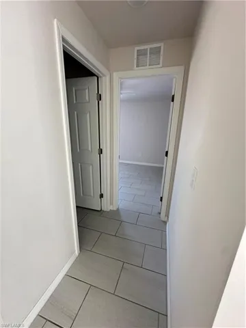 Hall featuring baseboards