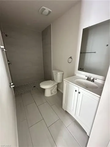 Bathroom with vanity and a shower stall