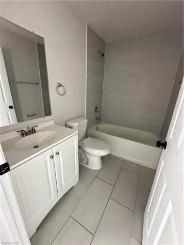 Full bath featuring vanity and tub / shower combination