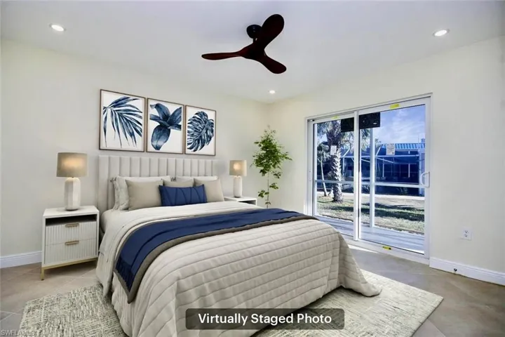 Bedroom featuring access to outside and ceiling fan