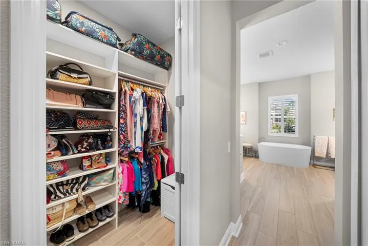 Well-appointed closet with custom shelving and hanging space