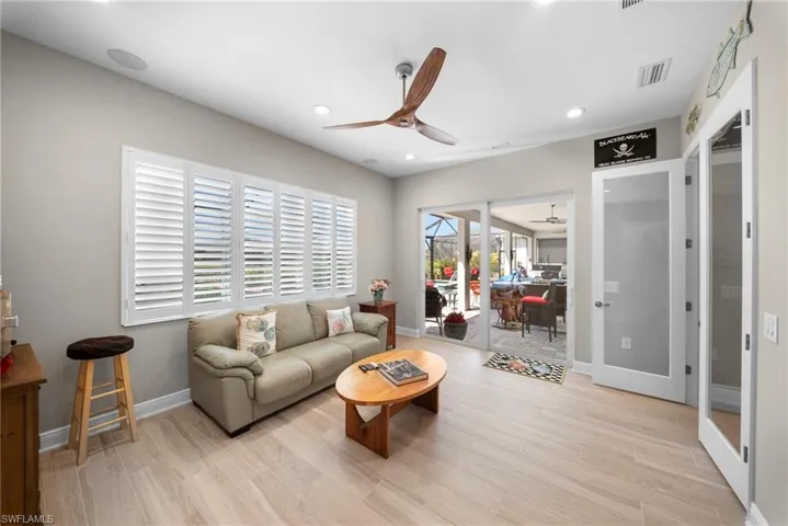 This room features light-toned flooring and white walls, creating a bright and airy atmosphere