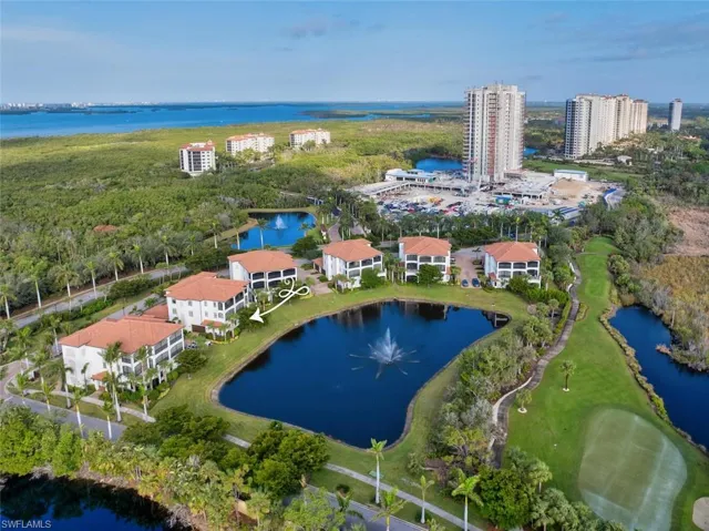 Birds eye view of property featuring a water view