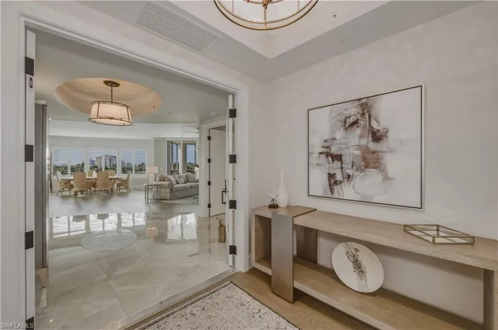 Hall with a tray ceiling