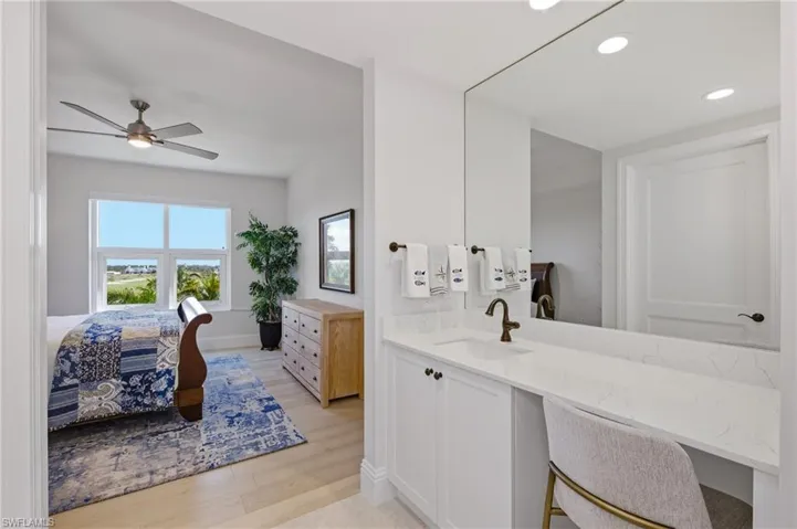Bathroom with vanity, light wood-style flooring, ensuite bathroom, recessed lighting, and a ceiling fan