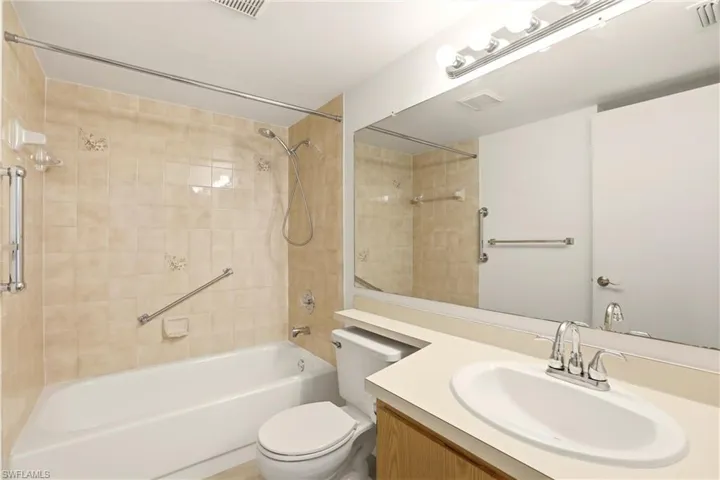 Full bath with vanity and tub / shower combination
