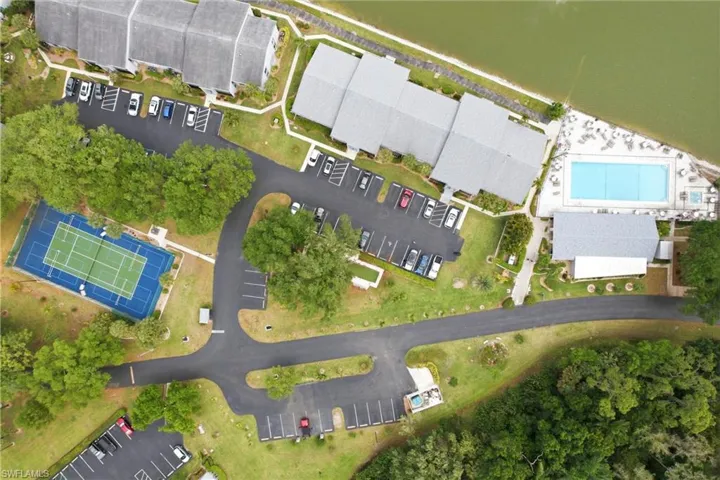 Bird's eye view of a pool area and pickleball court