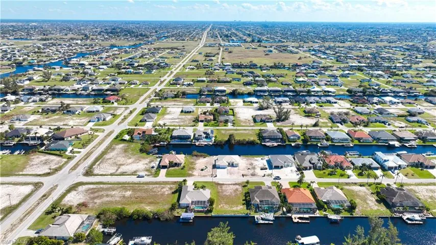 Aerial perspective showcasing a residential area with extensive canal access and numerous waterfront properties