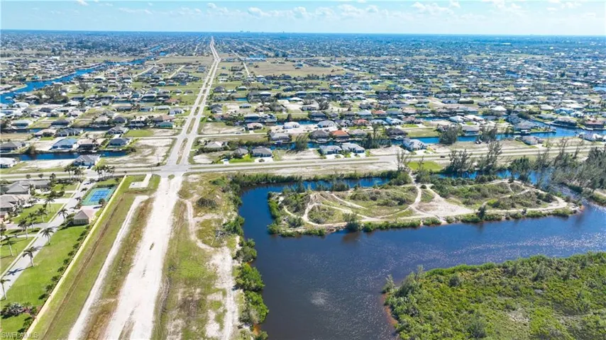 Expansive land parcel featuring direct water frontage and undeveloped terrain