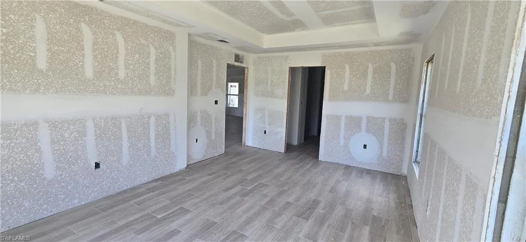 Spare room with wood finished floors