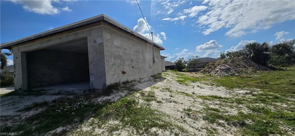 View of home's exterior featuring concrete block siding