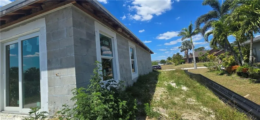 View of side of property with concrete block siding