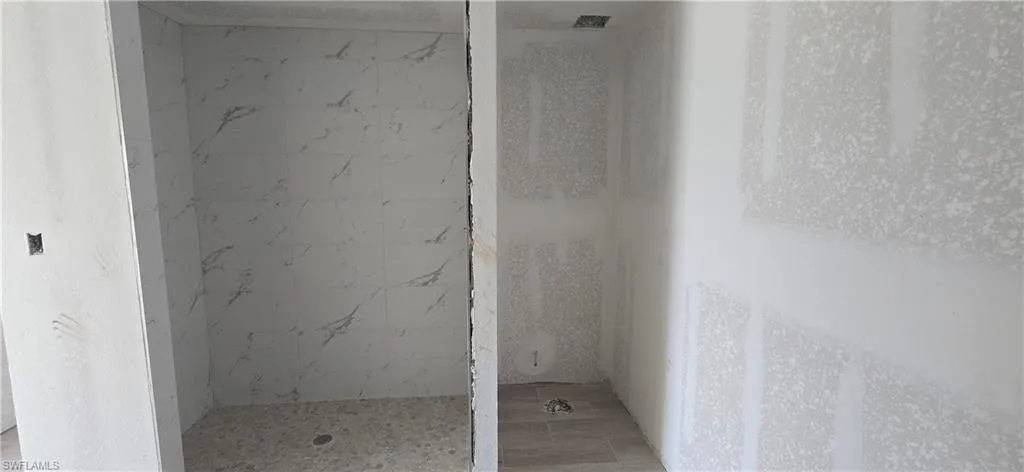 Bathroom with tiled shower