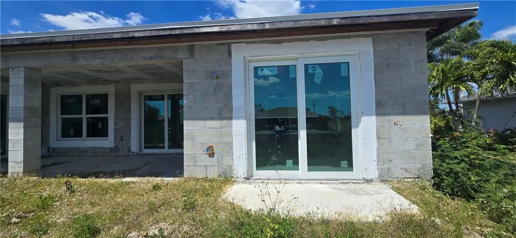 View of property exterior with stone siding