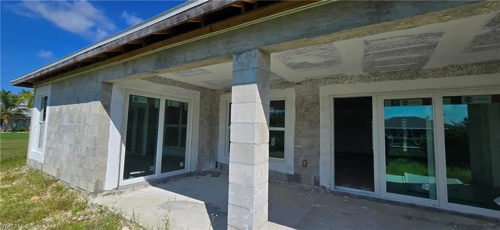 View of exterior entry featuring french doors