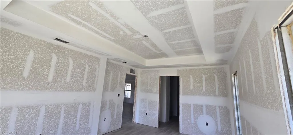 Unfurnished bedroom with wood finished floors