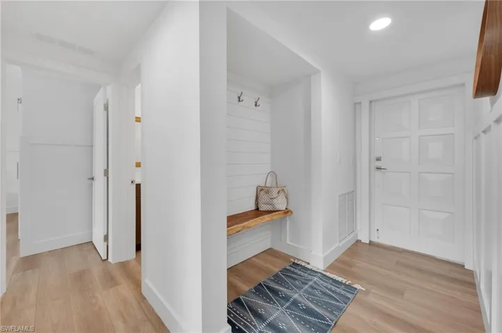 Entry w/wooden bench and storage