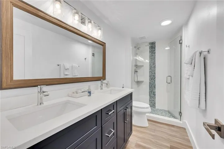 Guest bath with dual sinks and custom tile shower