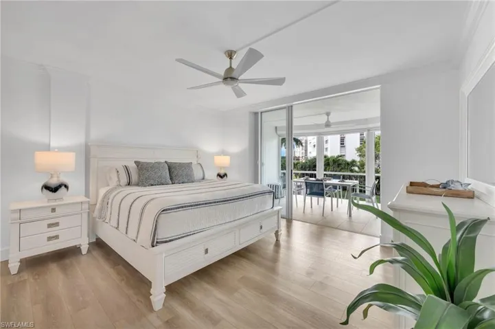 Guest bedroom with access to lanai and water views