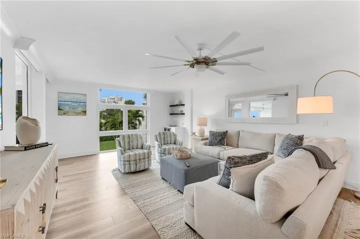 Open living with Wide plank wood floors