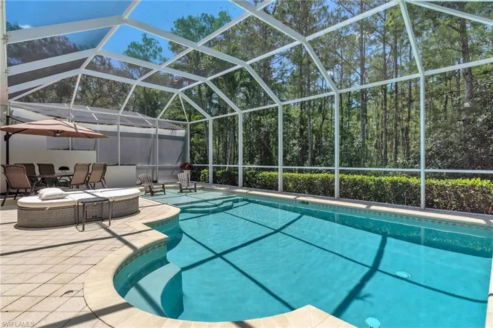 Outdoor pool featuring a patio area and a lanai