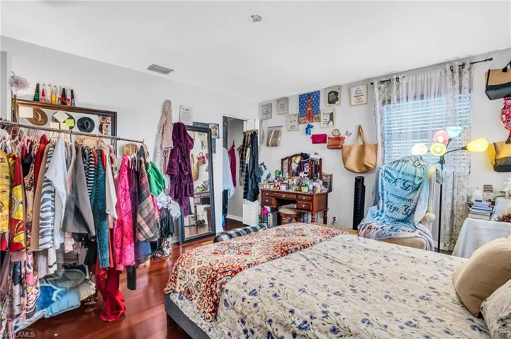 Bedroom with hardwood / wood-style floors