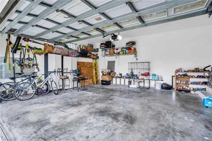 Garage featuring a garage door opener
