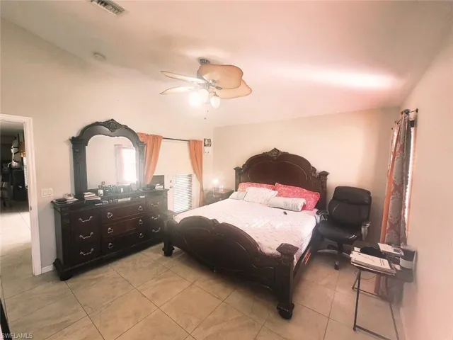 Bedroom featuring ceiling fan and light tile patterned floors