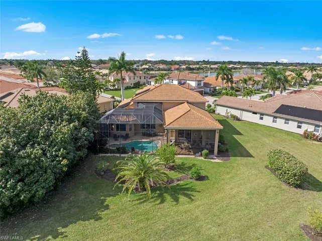 Aerial view of rear of home, showing large back yard