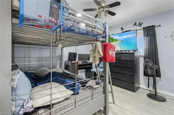 Bedroom featuring light wood-type flooring and ceiling fan