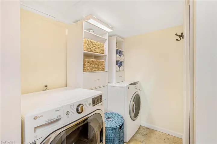 Laundry room featuring washing machine and clothes dryer