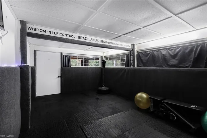 Miscellaneous room with a paneled ceiling