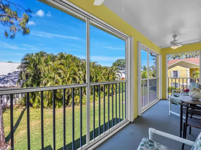 Sunroom / solarium featuring carpet floors