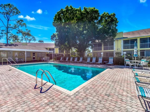 Community pool with a patio area