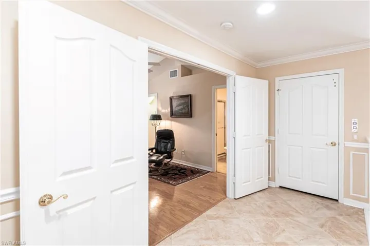 Large double doors lead to the office or flex space